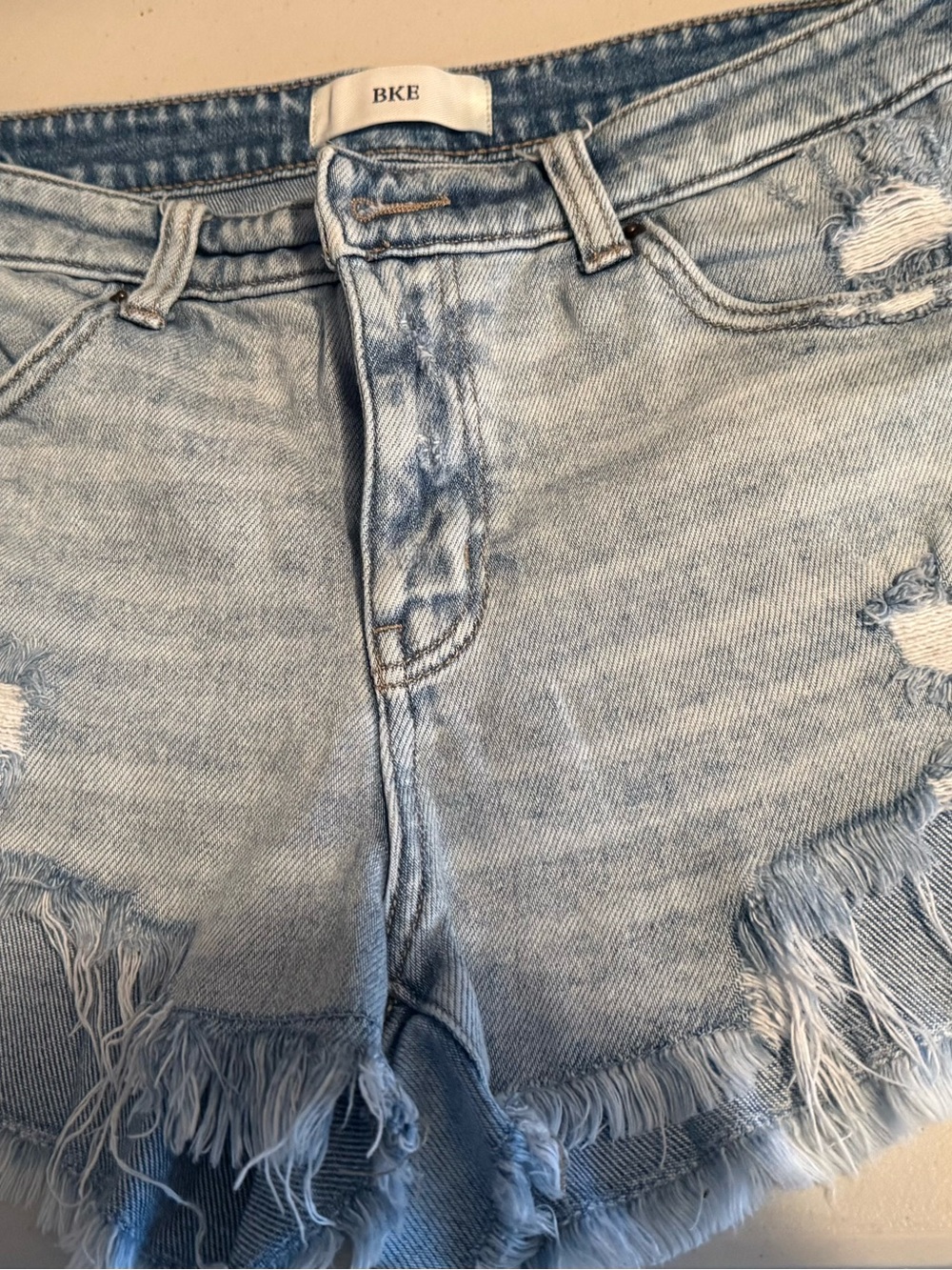 BKE Denim “Payton” distressed denim shorts, women’s size 29.